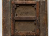 an old wooden picture frame with a piece of paper on top of it