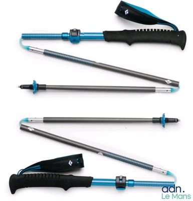 four different types of ski poles are lined up on a white surface