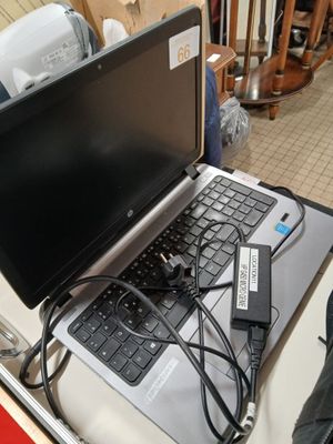 a laptop computer sitting on top of a table