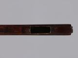 a close up of a wooden pipe with a hole in it
