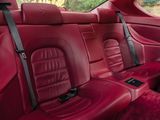 the interior of a car with red leather seats and black trims