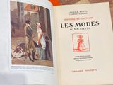 an open book with a picture of a couple and a dog