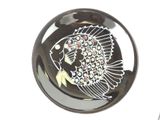 a black and white plate with a fish design on it