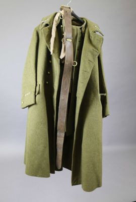 an image of a coat hanging on a clothes rack in a room