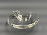a clear glass bowl with a bird on it