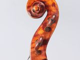 an old violin with a wooden bow on a white background