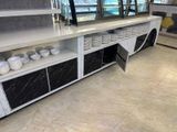 a buffet with a lot of plates and bowls on it