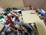 a box full of legos that are sitting on the floor