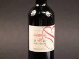 a bottle of wine that is sitting on a table