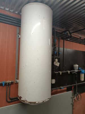 a water heater that is on the wall of a building