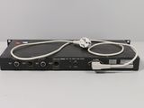 a close up of a black box with a white cord attached to it