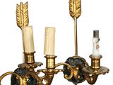 pair of antique brass wall sconces with candles and a candle holder