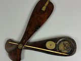 two wooden paddles that are attached to each other