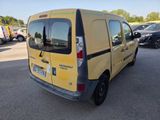 a yellow van that is parked in a parking lot