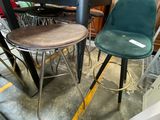 two stools and a table in a room
