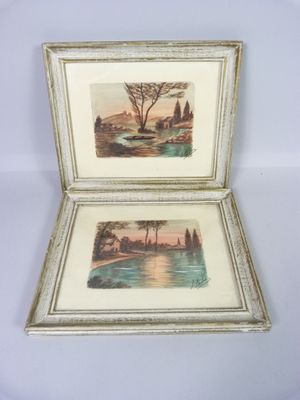 two framed pictures of a landscape with a river and trees