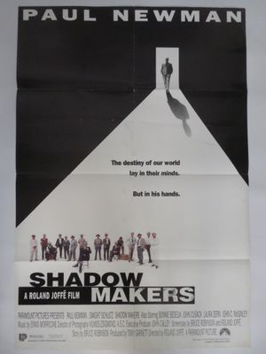 the poster for the movie shadow makers is hanging on the wall