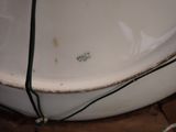 a white bowl sitting on top of a wooden table