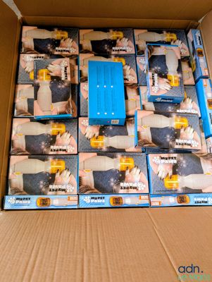 a cardboard box with a bunch of blue and yellow items in it