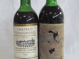 two bottles of wine sitting next to each other on a table