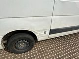 a van that has been vandalized with a sticker on it