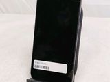 a cell phone that is sitting on top of a stand