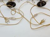 a table with a bunch of wires and plugs on it