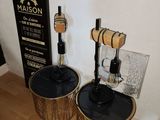 two wooden barrels sitting on the floor next to each other