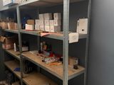 a shelf with many items on it in a room