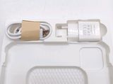 a white tray with a charger and a cable