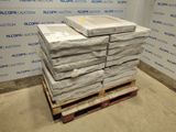 a stack of boxes sitting on a pallet in a room