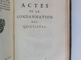 an open book with a picture of a coat of arms on top of it