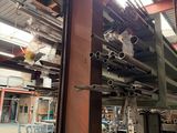 an image of a factory with a lot of steel pipes