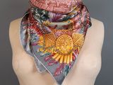 a close up of a mannequin torso with a scarf on it