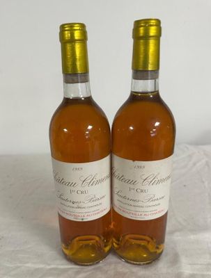 two bottles of wine sitting on a table next to each other