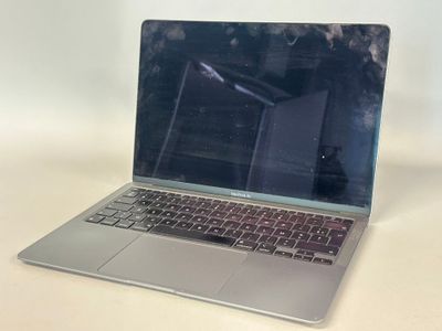 a laptop computer sitting on a table with a blurry background