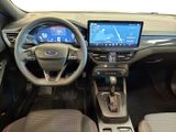 the interior of a car with a steering wheel, dashboard, and display screen