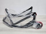 a scooter that is wrapped in plastic and sitting on the floor