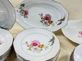 a lot of plates that are sitting on a table