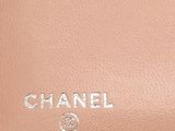 chanel, a beige leather bag with a logo on the front
