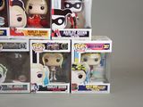 a bunch of pop vinyl figures in a display case
