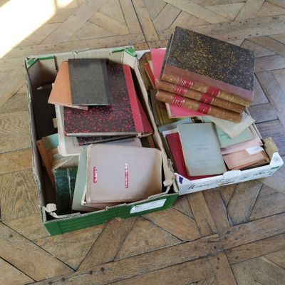a box full of books sitting on the floor