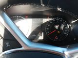 a close up of a car dashboard with a speedometer
