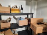many boxes and bottles on the shelves in the room