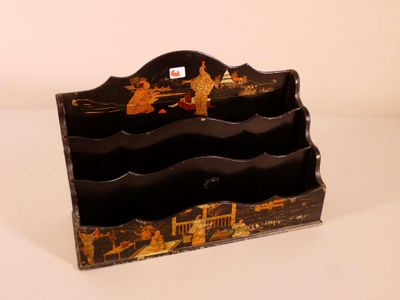 a small wooden box with a picture of people on it