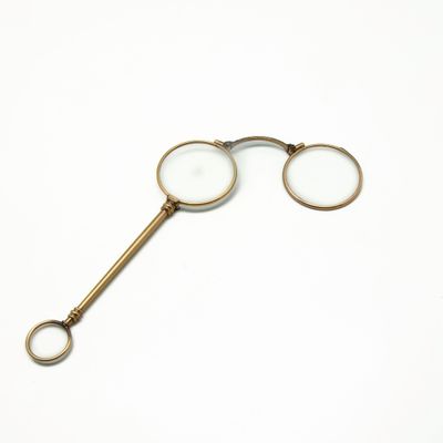 a close up of a pair of glasses on a white surface