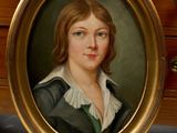 portrait of a young woman in a green dress and white collared shirt