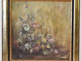 a painting of flowers in a gold frame on a white wall