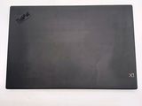 a black mouse pad on a white surface with a black mouse