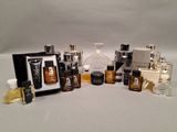 the contents of a variety of perfumes are displayed on a white surface
